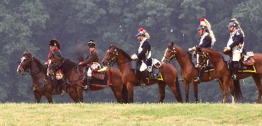 Dragoon reenactors sitting atop their horses overlook Valley Forge NHP.